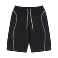 Black shorts with white piping on a white background